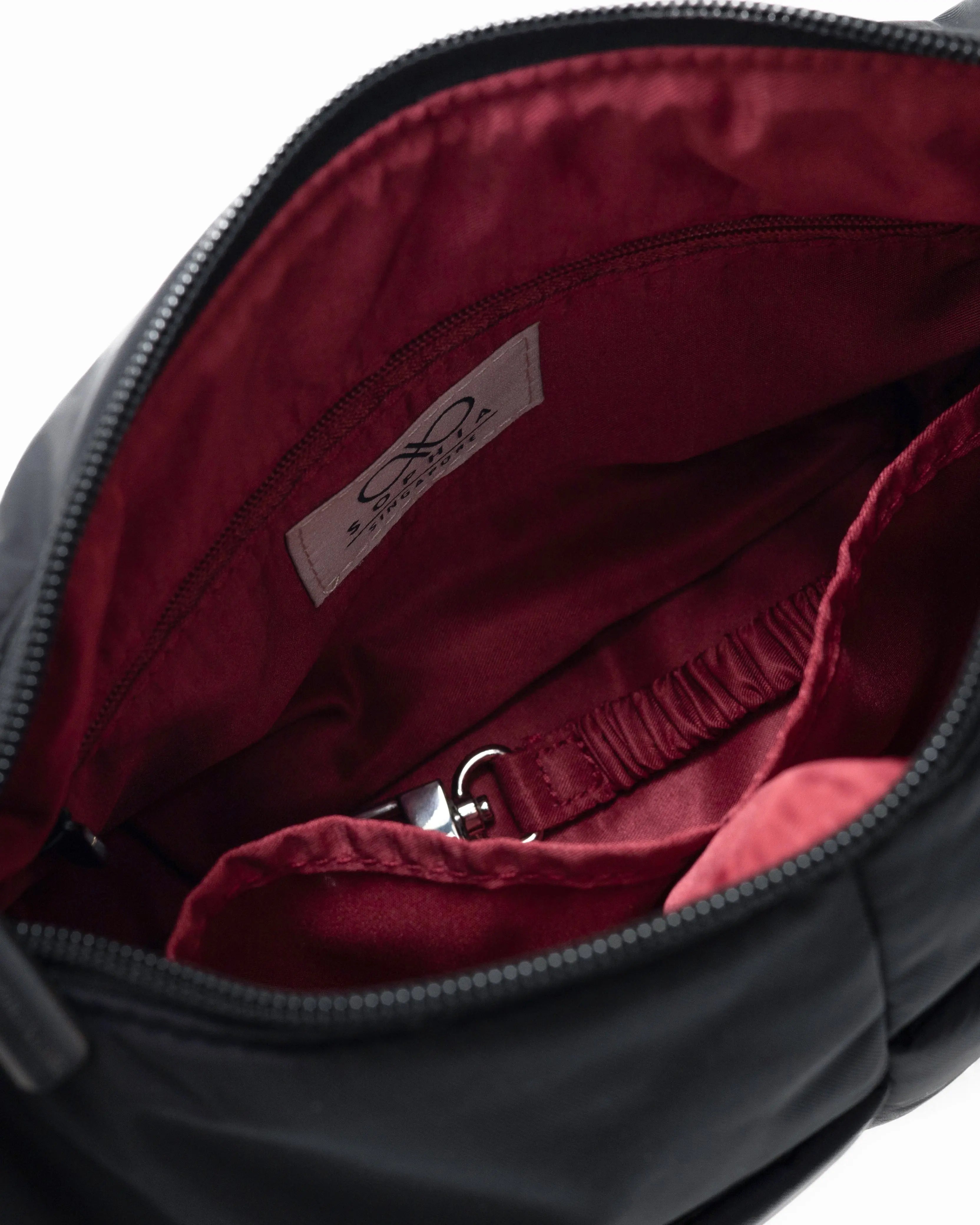 MINI SIGNATURE POCKET CROSSBODY BAG IN POSH JET BLACK 