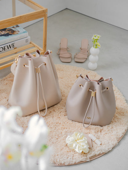 MINI REINA MAGIC BUCKET BAG IN TAUPE